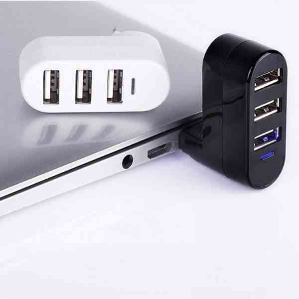 USB Hub Splitter – Multi-interface USB splitter in black and white plugged into a laptop for fast connectivity and efficient port expansion.
