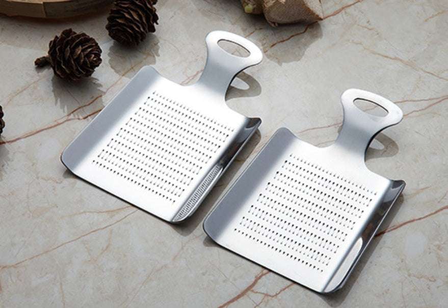 Stainless steel garlic press for home cooking