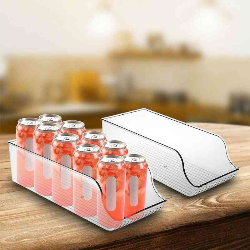 Two transparent fridge drink holders filled with red soda cans, displayed on a kitchen counter as smart kitchen storage solutions.