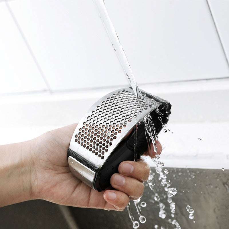 Stainless steel garlic press for home cooking