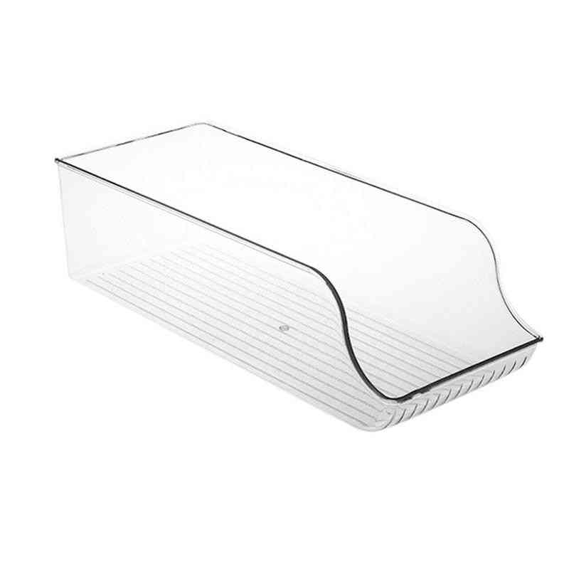 Empty transparent refrigerator beverage organizer with curved front, designed for storing cans and optimizing fridge space efficiently.