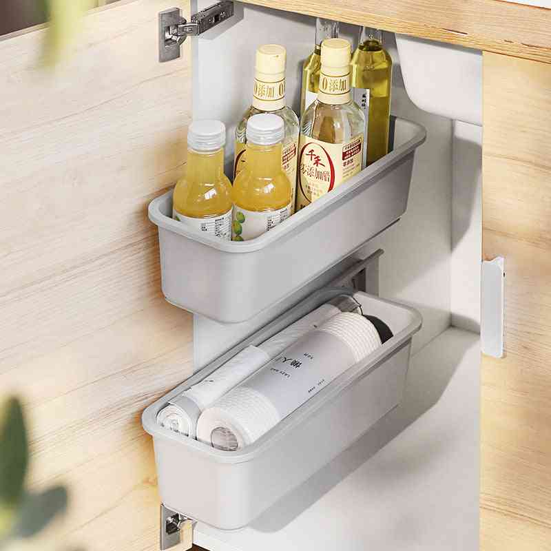 Under sink organizer rack designed for holding sponges, sprays, and cleaning tools.