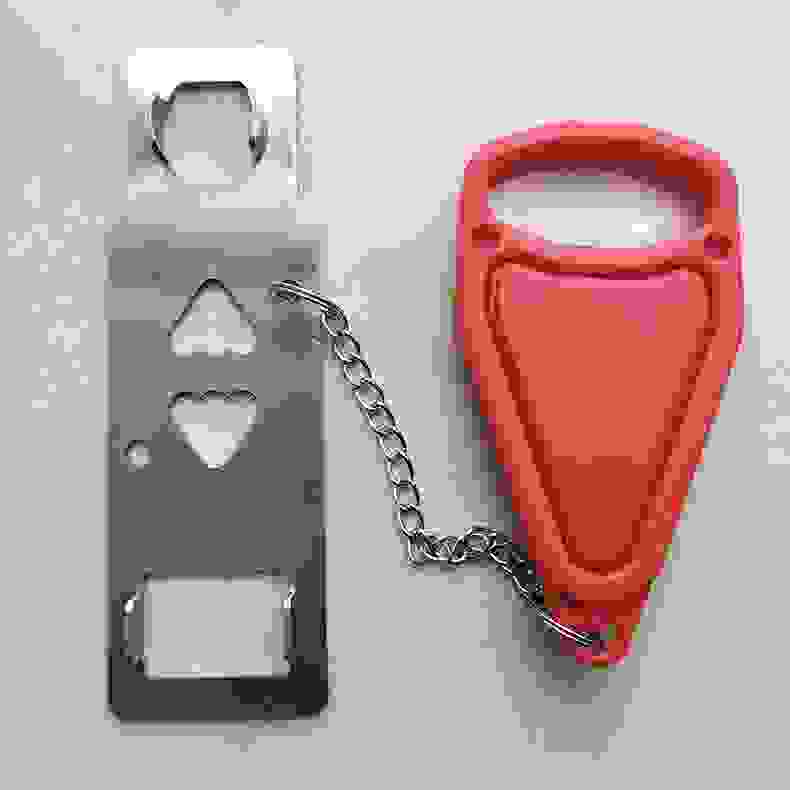 Door Stopper Dual-use Portable Door Snap Lock Security Hotel Top Door Opener being installed on a door for added safety. Ideal for travel, dorms, or home use.