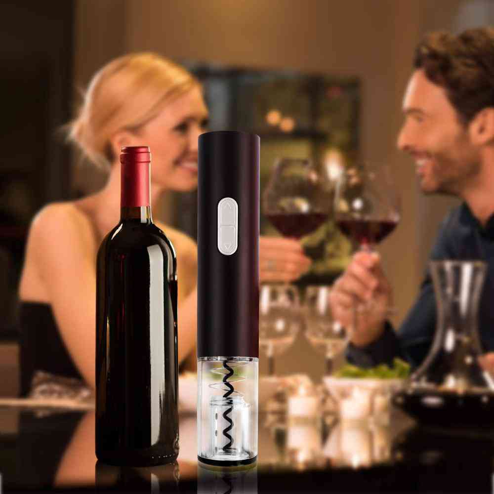 Automatic corkscrew wine opener in use during a romantic dinner. Perfect electric wine opener kit for home bars and celebrations.