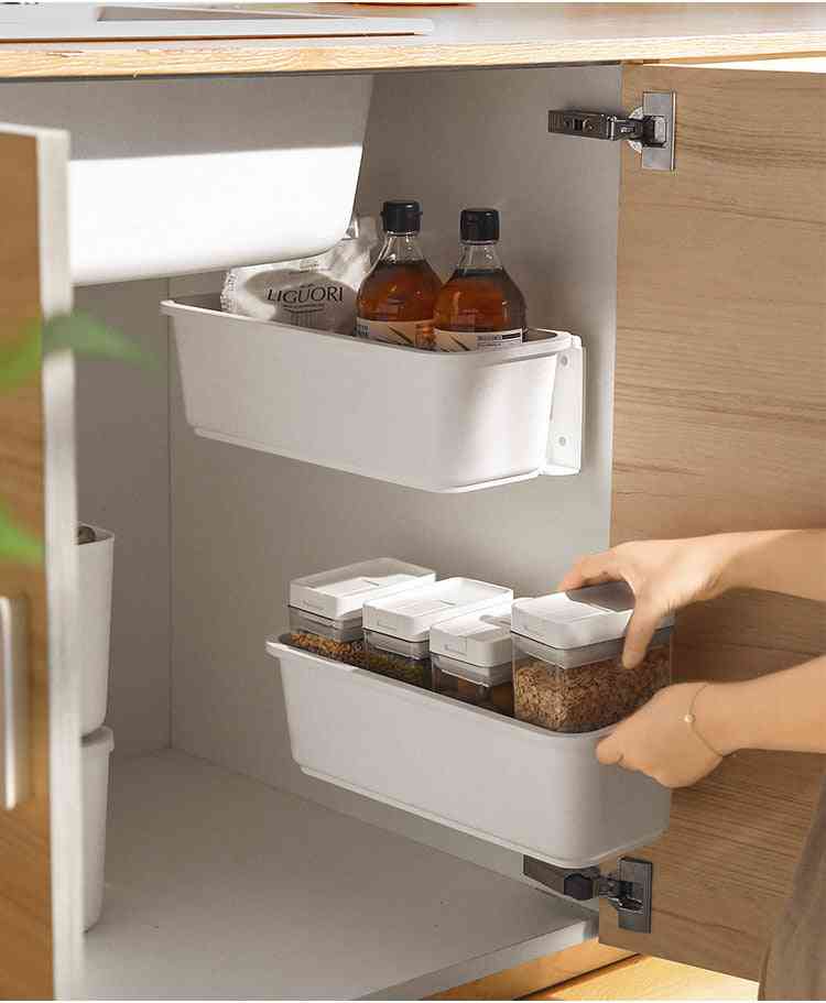 Kitchen under-sink drawer organizer with sliding shelves for detergents and bottles
