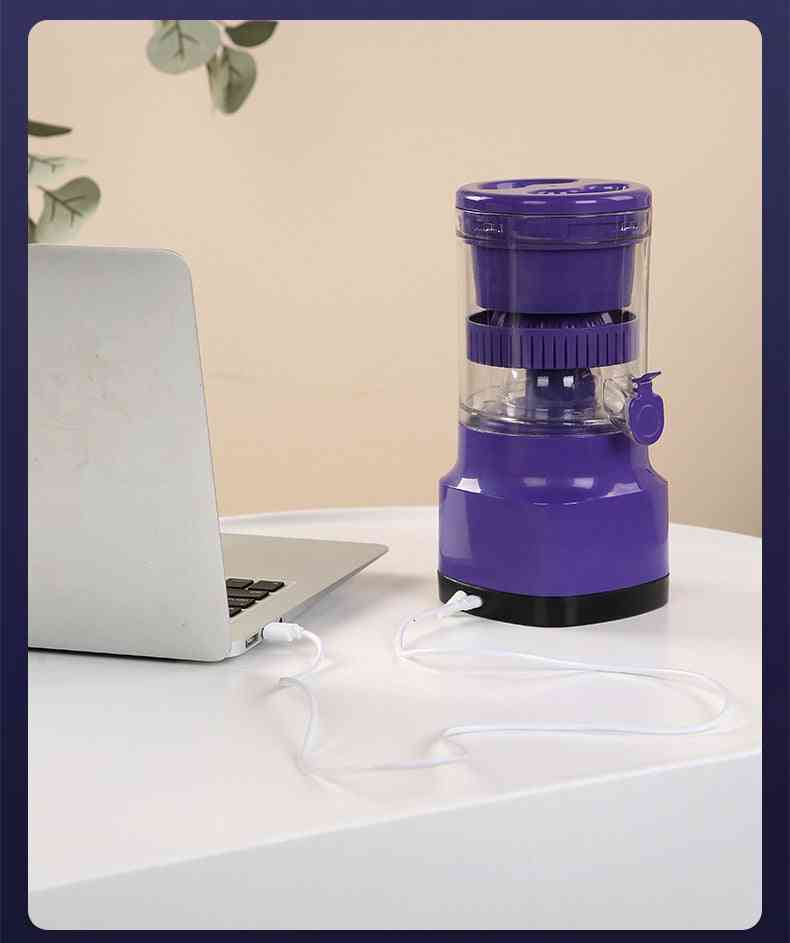 USB rechargeable electric orange juicer connected to a laptop, ideal for portable juicing in smart kitchen setups or office use.