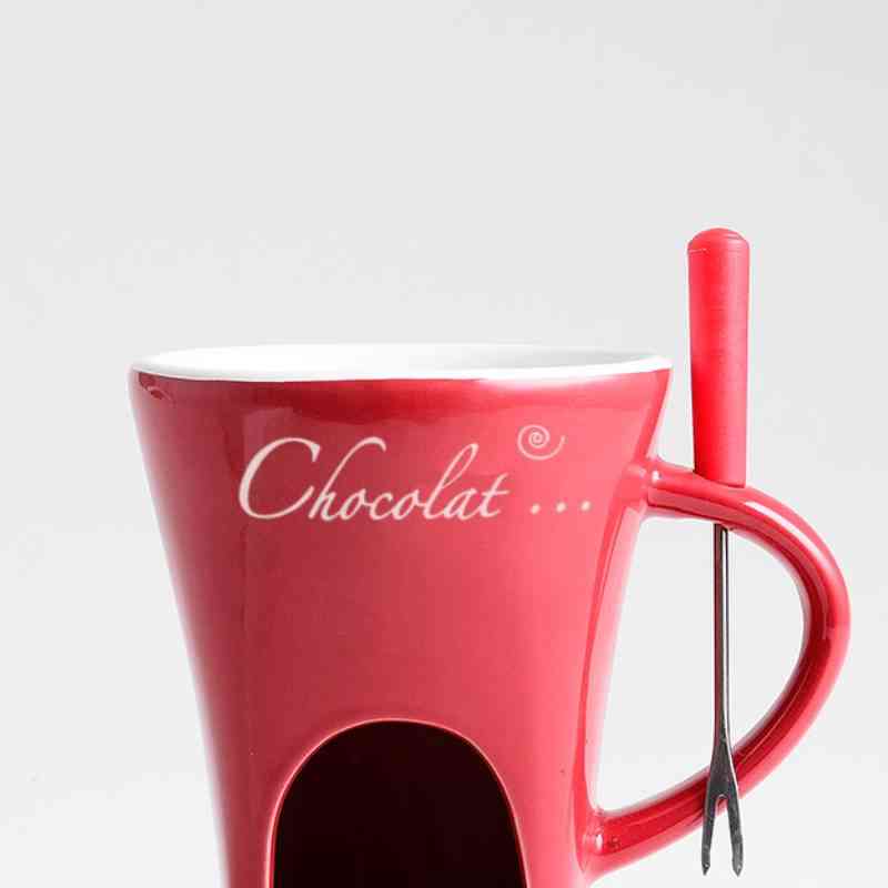 Close-up of red Fondue Mug Set – Personal Mini Chocolate Fondue Pot with fork, designed for home chocolate melting and dipping.