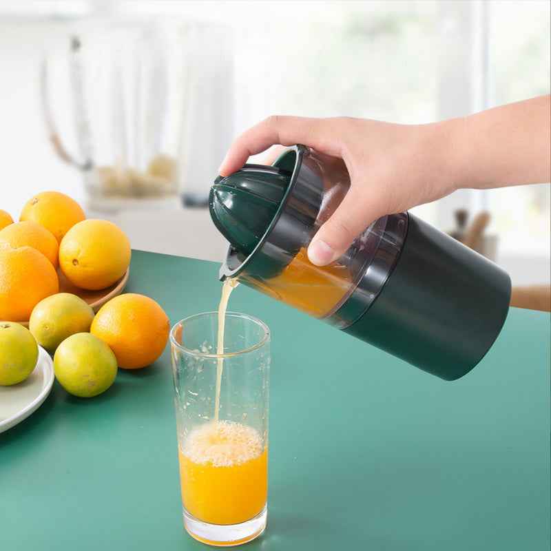 Electric Mini Fruit Juicer pouring fresh orange juice into a glass, ideal for portable blending and citrus pressing in modern kitchens.